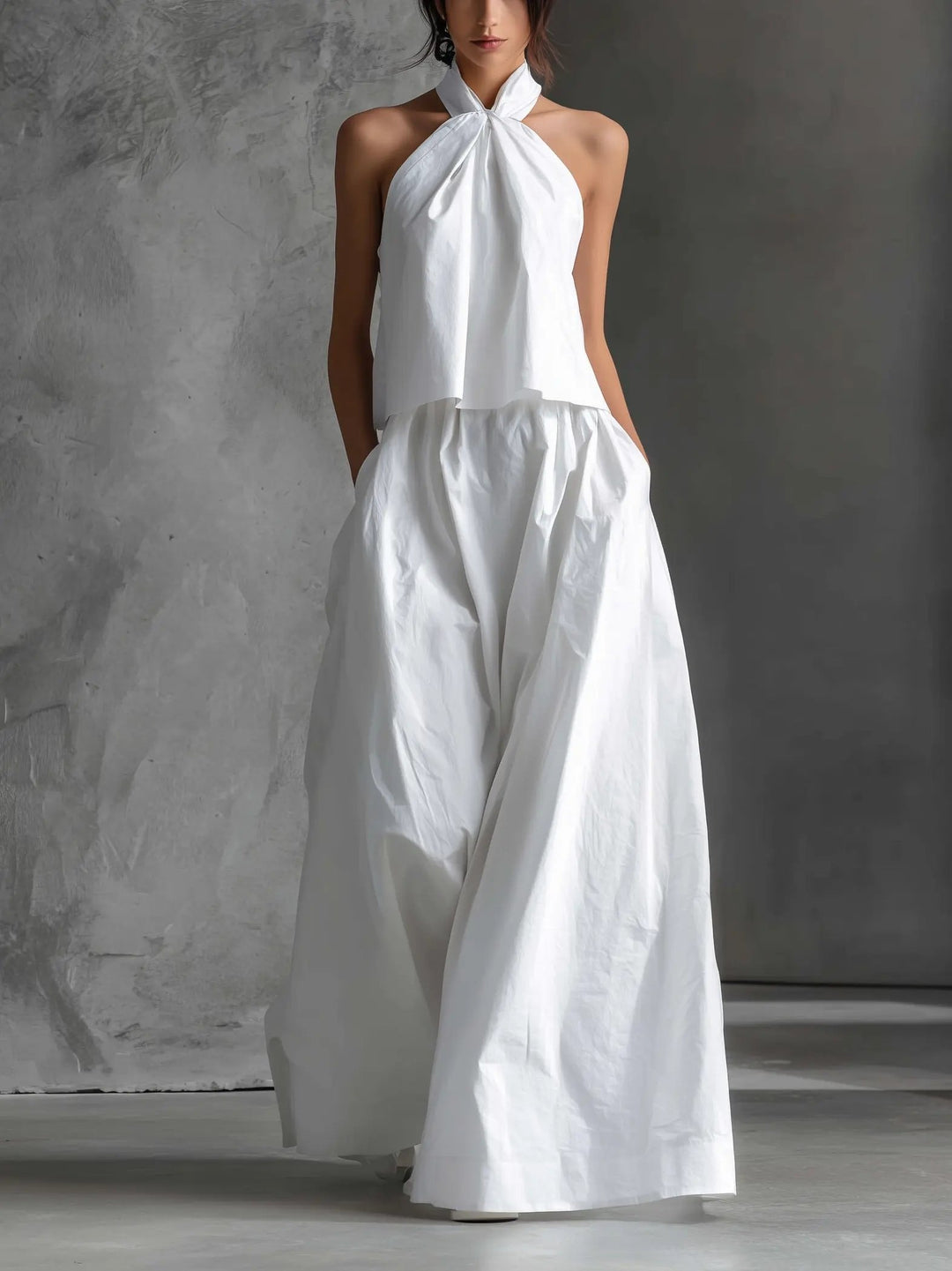 Elegant women's halter neck two-piece set with flowy maxi skirt, perfect for summer vacations & beachwear.