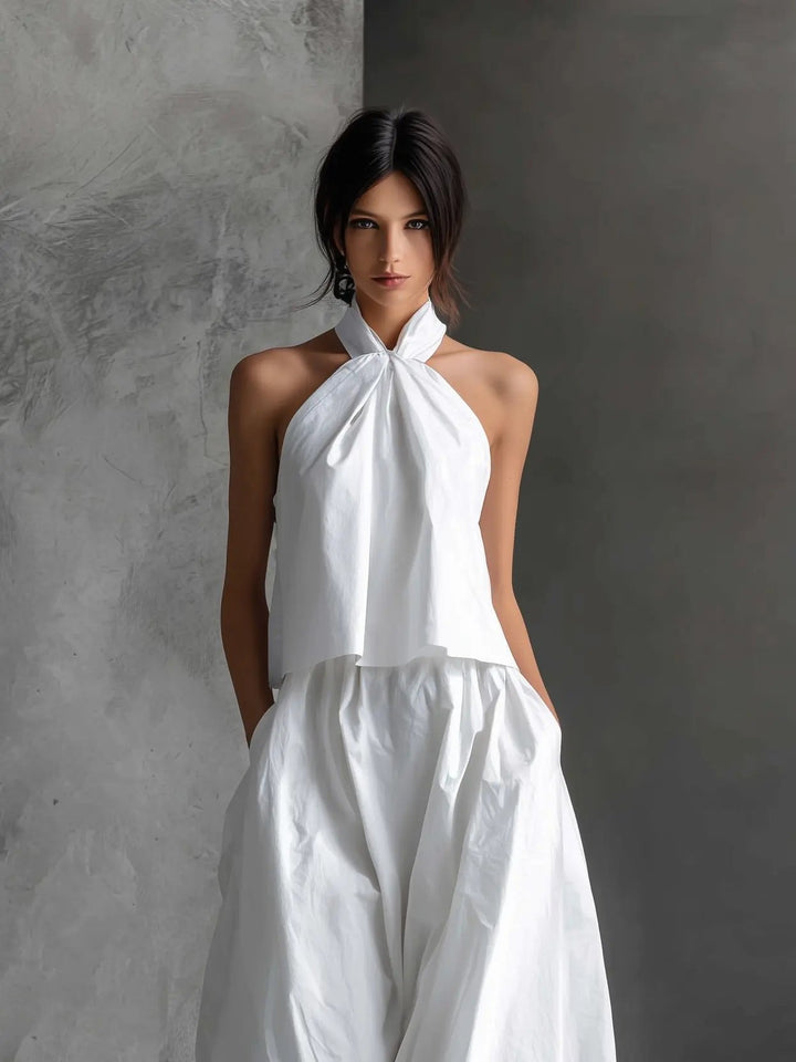 Stylish women's halter top & matching maxi skirt two-piece set. Ideal for elegant summer holiday outfits.