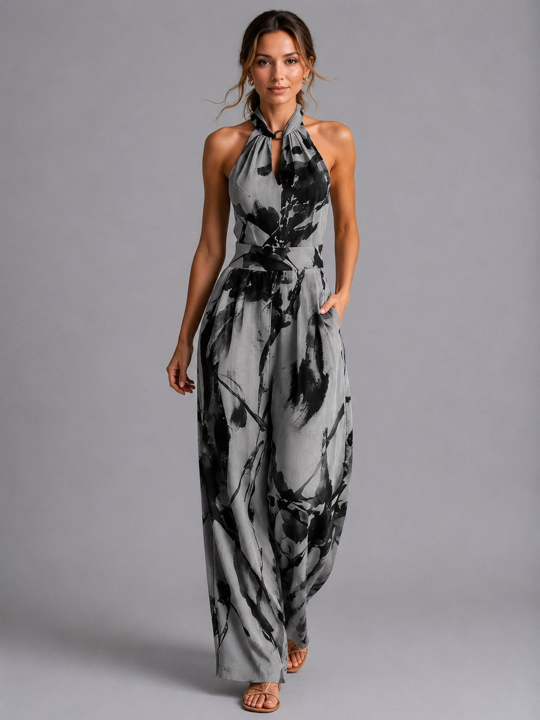 Printed halter neck wide-leg jumpsuit for women, offering an elegant and relaxed fit for any casual or vacation wear.