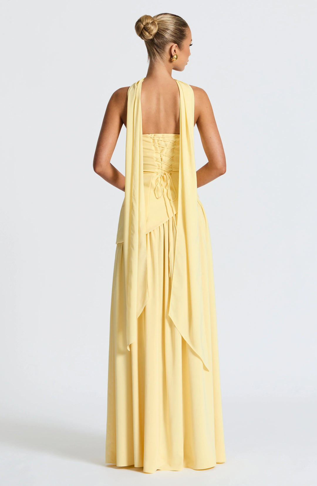 Elegant women's evening wear: halterneck long dress with a bold high split.