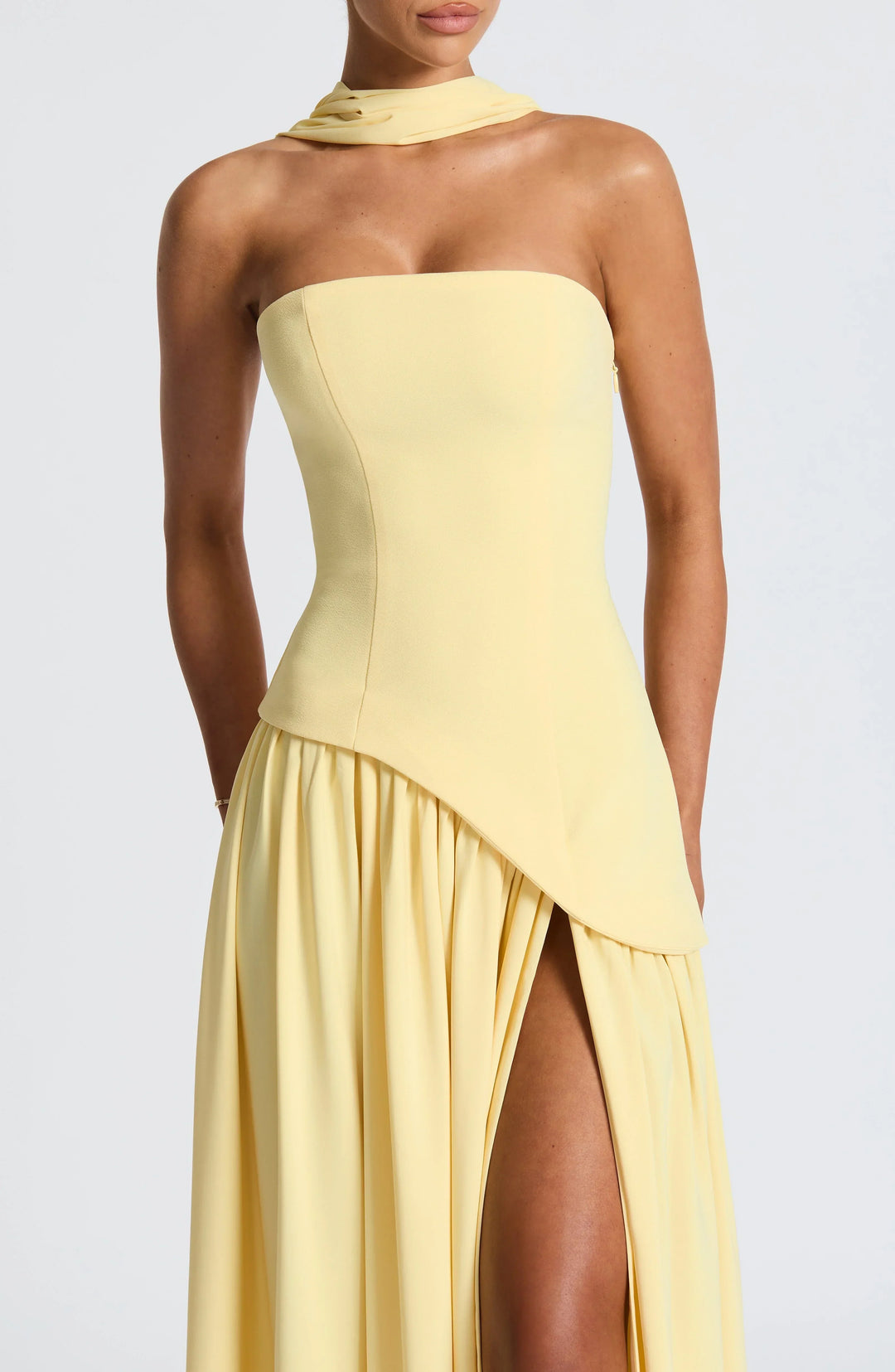 Women's formal wear: stunning halterneck maxi dress with a flattering high slit.