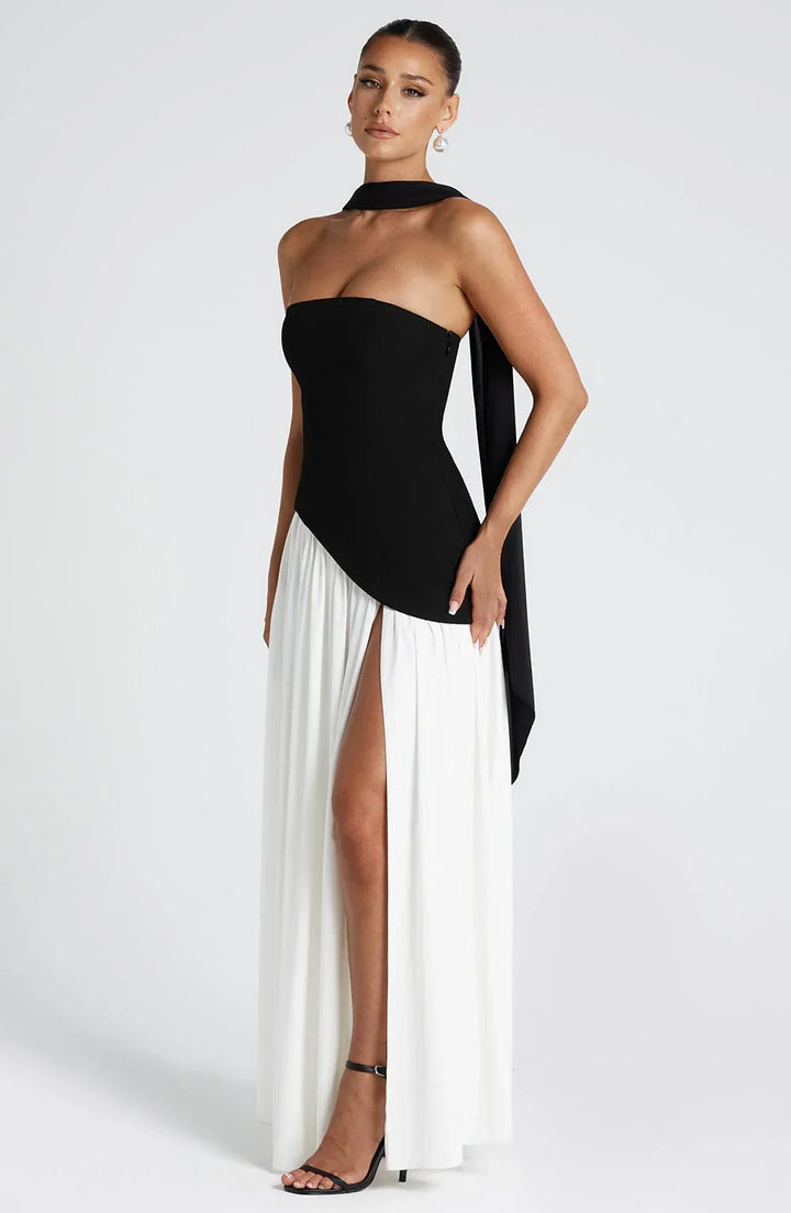 Sophisticated women's wedding guest dress, halterneck style, and a dramatic high split.
