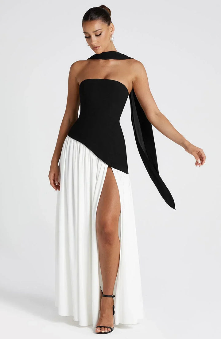 Glamorous halterneck evening gown, long, flowing, and featuring a high leg split.