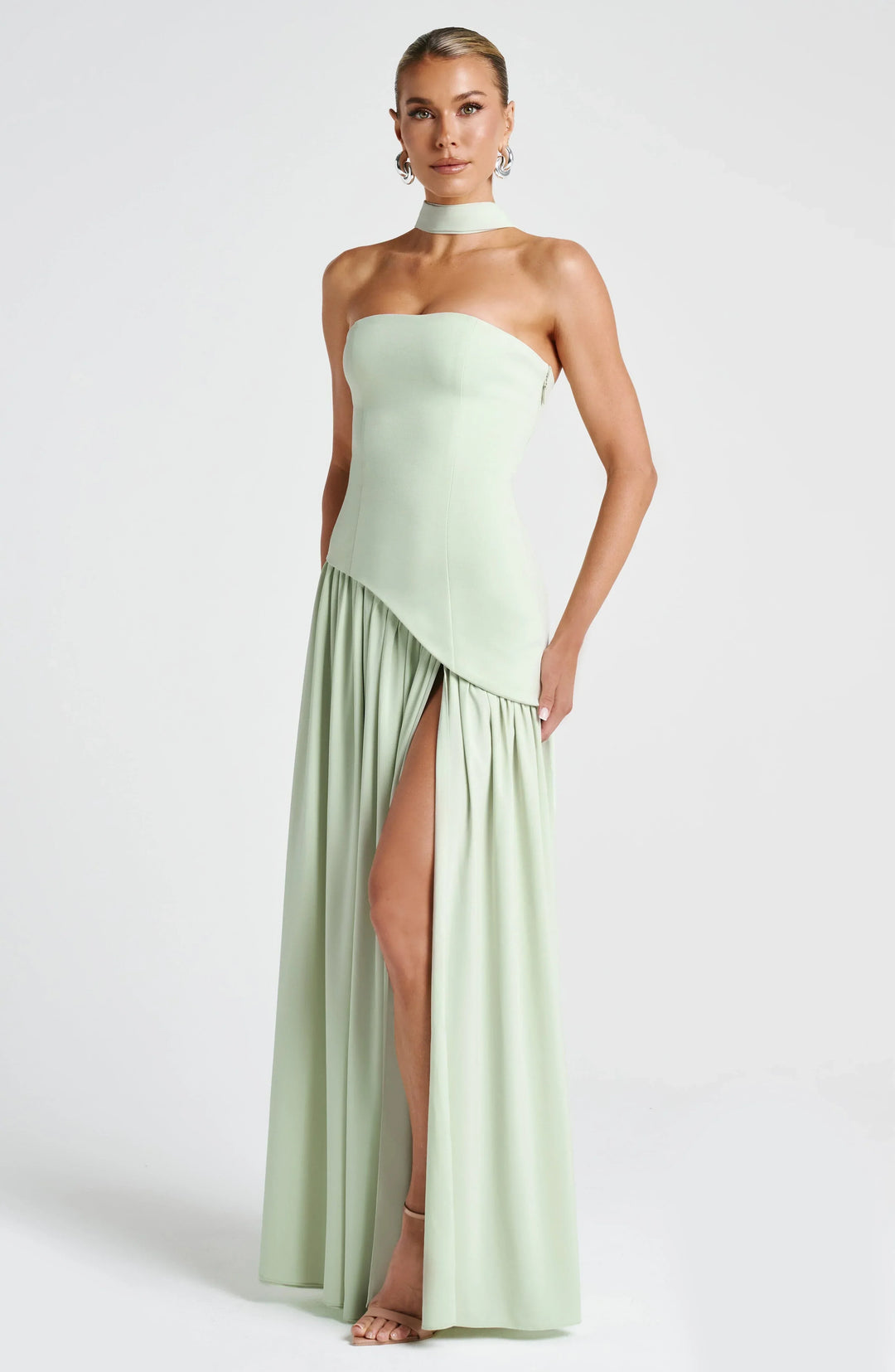 Flowy halterneck wedding guest maxi dress for women, featuring a graceful high split.
