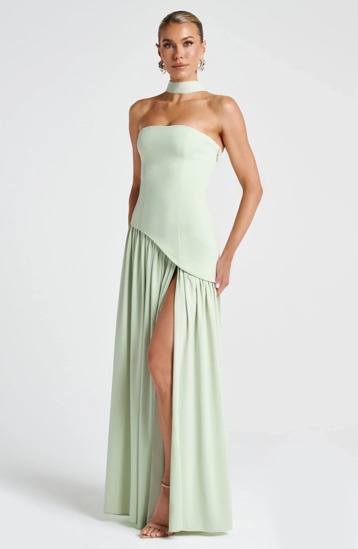 Flowy halterneck wedding guest maxi dress for women, featuring a graceful high split.