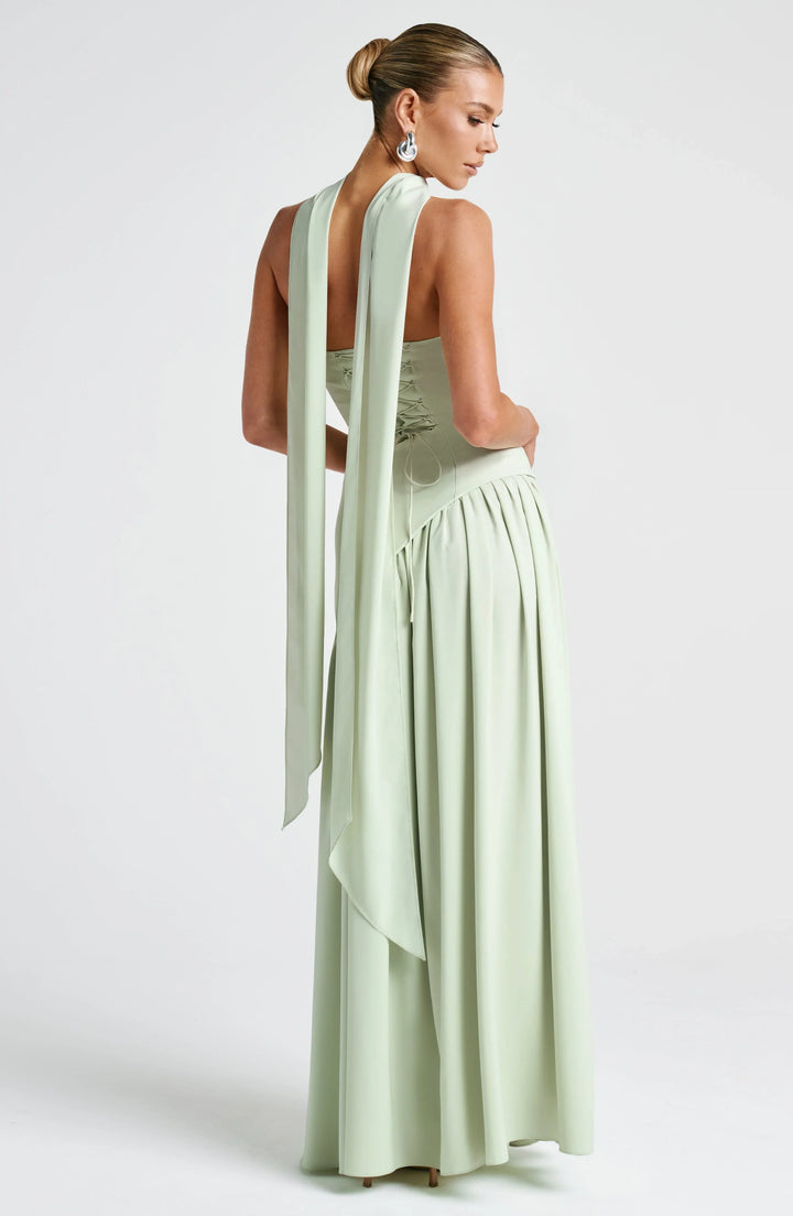 Women's evening halterneck gown with a high split, perfect for elegant events.