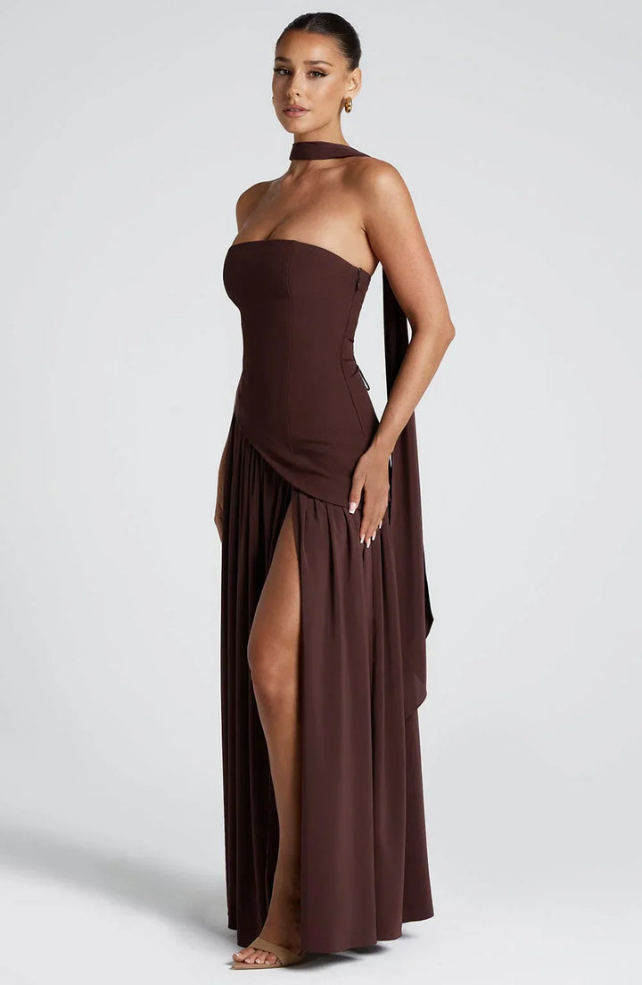 Flowing wedding guest dress, elegant halterneck silhouette with a tasteful high split.