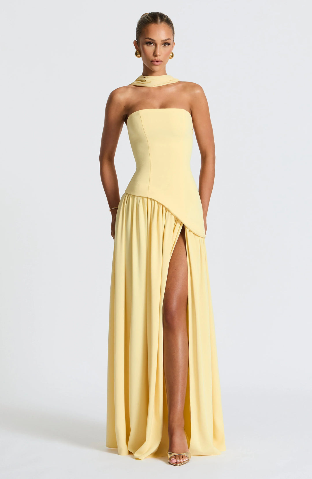 Fashionable formal women's halterneck gown, long & elegant with a thigh-high split.
