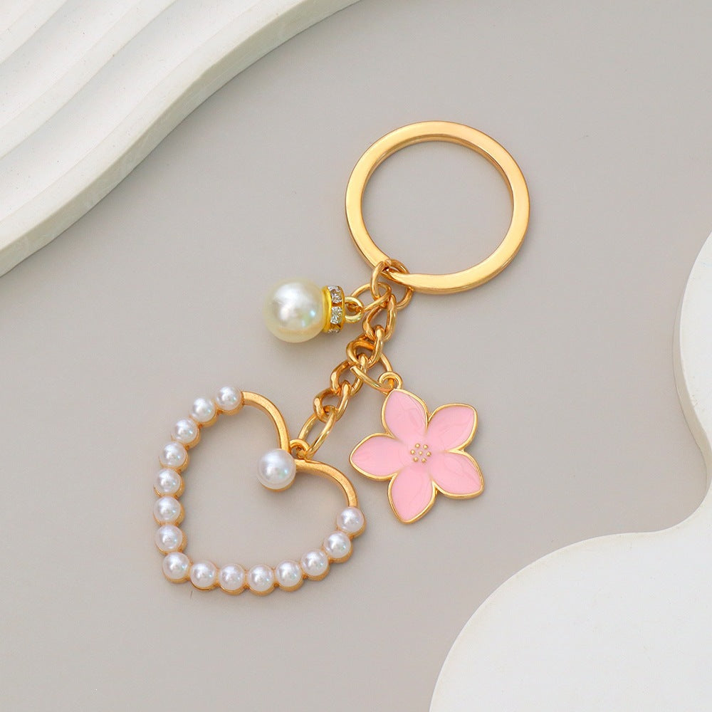 Unique heart and flower design keychain, a stylish accessory for women's bags and keys.