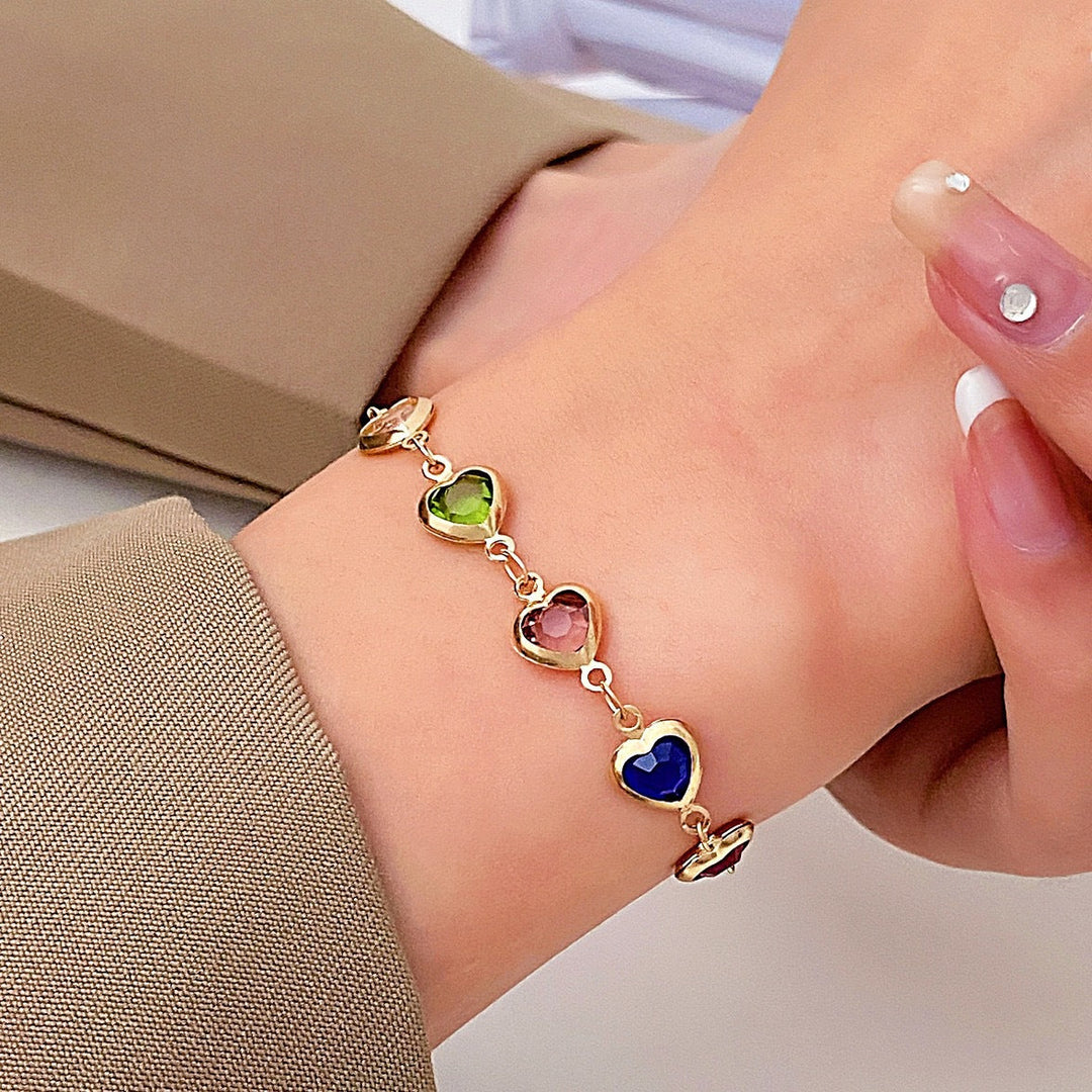Chic women's ankle adorned with an adjustable heart gemstone anklet, a stylish fashion accessory.