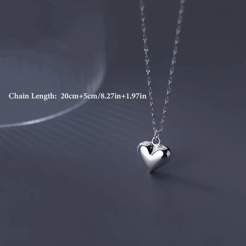 Women's elegant silver heart pendant necklace, a timeless and thoughtful love gift for her.
