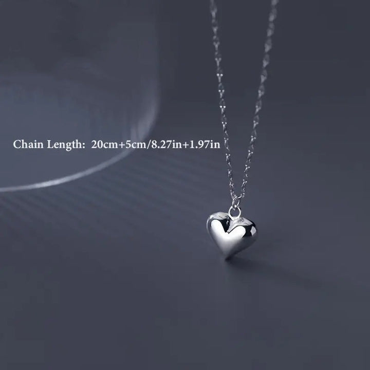 Women's elegant silver heart pendant necklace, a timeless and thoughtful love gift for her.
