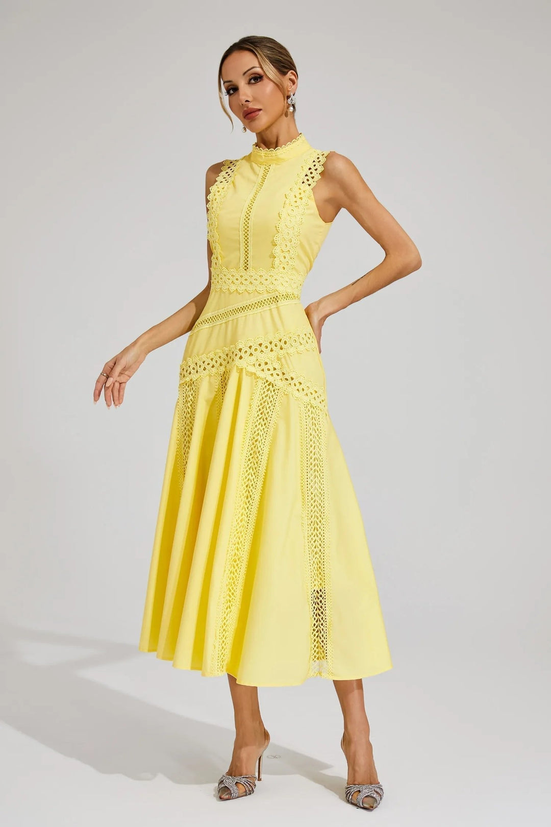 Chic sleeveless lace midi dress for women, ideal as a sophisticated wedding guest outfit or party wear.