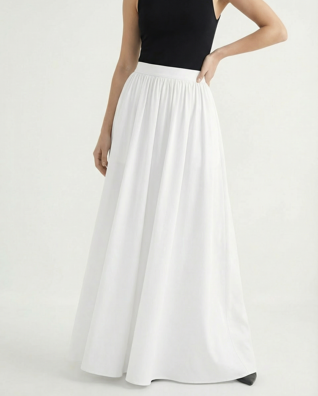 Minimalist elegant high-waist maxi skirt, flowing silhouette for versatile women's fashion.