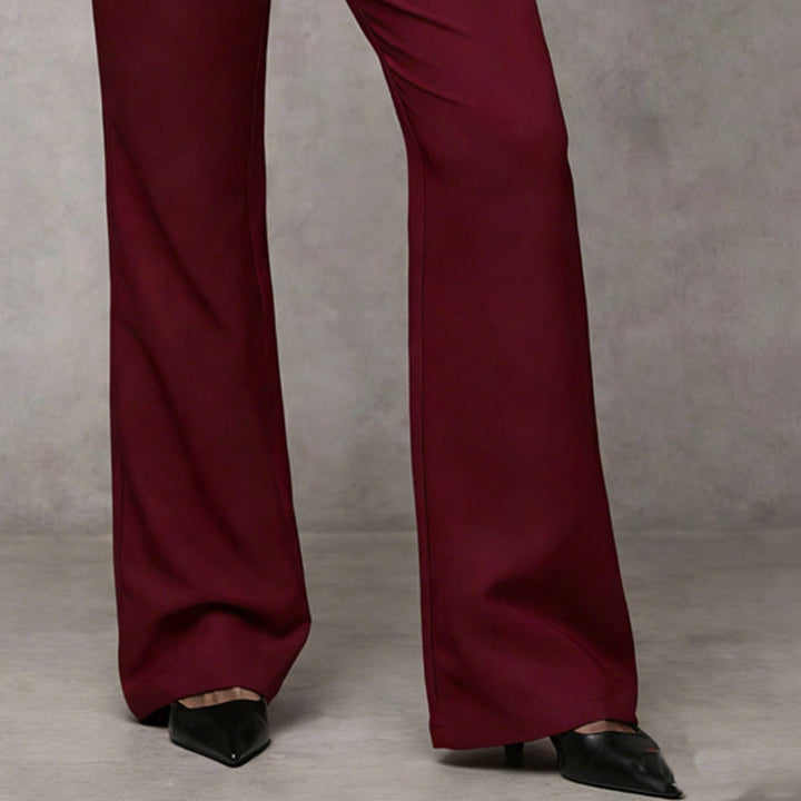 Stylish women's high-waist wide-leg flared trousers, highlighting the modern cut and fit.