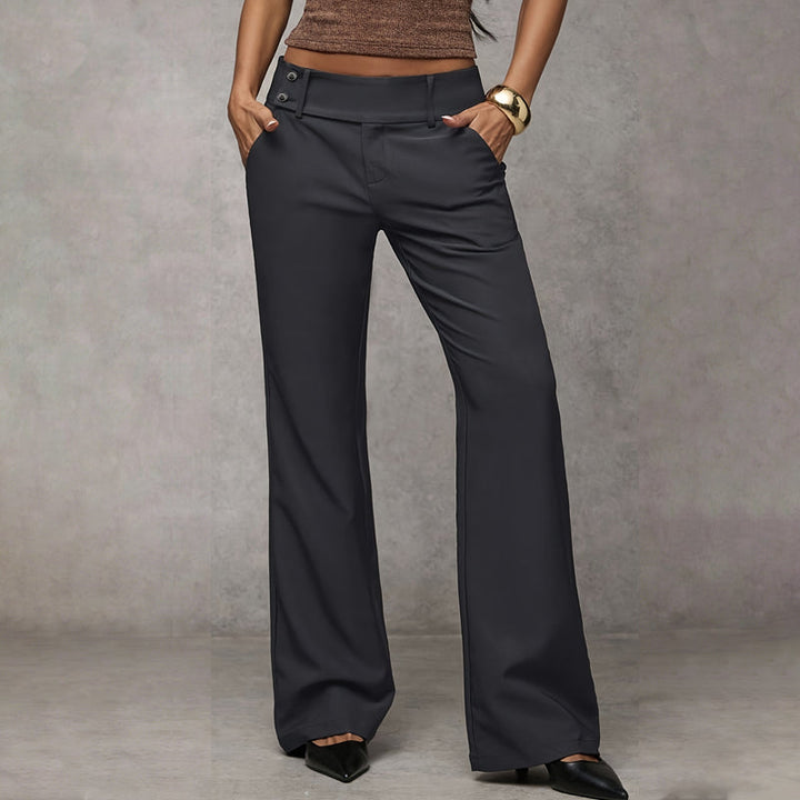 Close-up of the flattering high-waist detail on women's wide-leg flared trousers.