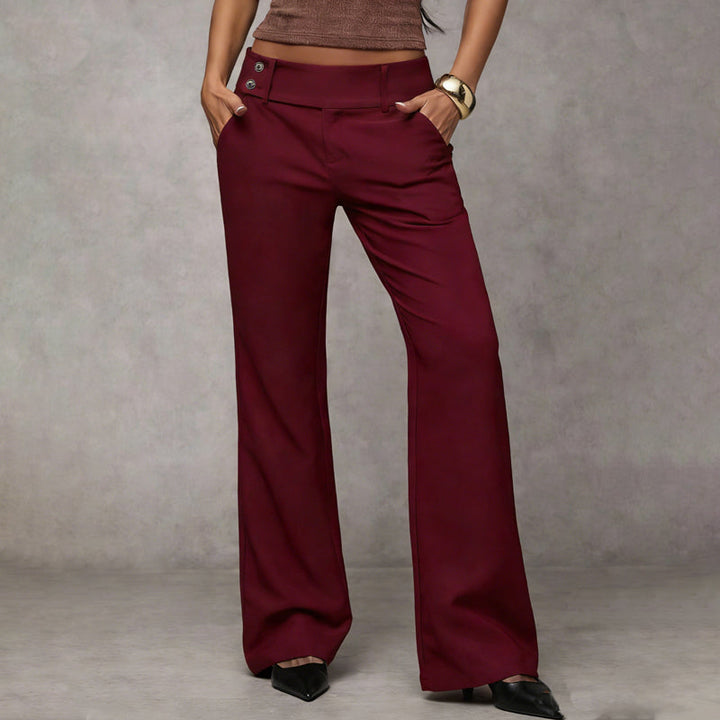 Flared hem detail on women's high-waist wide-leg trousers, adding an elegant touch to any outfit.