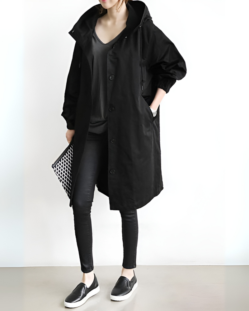 Elegant women's hooded trench coat for autumn/winter. Classic, long sleeve, single-breasted outerwear. Timeless style.
