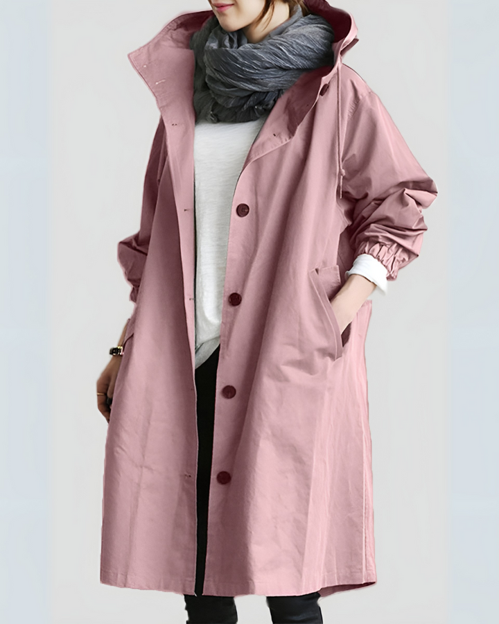 Timeless women's hooded trench coat. Elegant, loose fit, single-breasted outerwear for classic autumn/winter style & comfort.