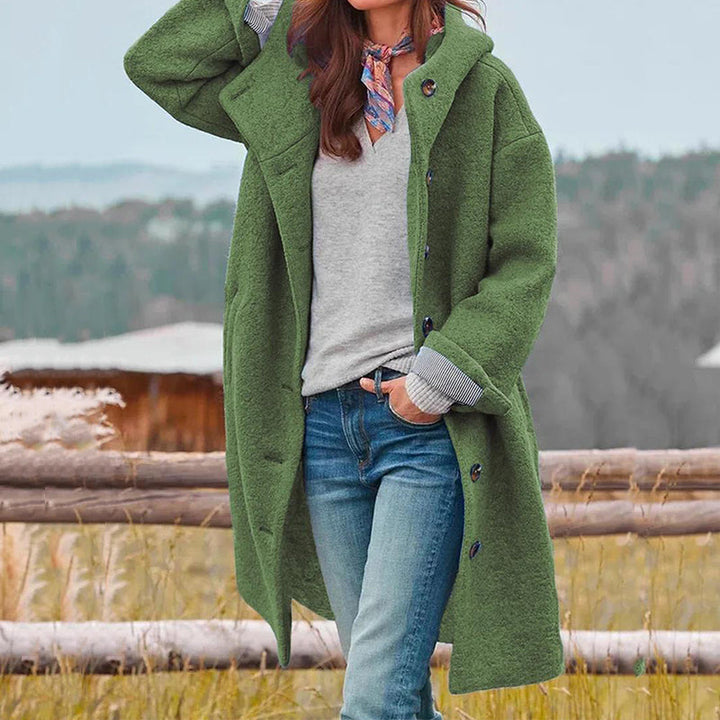 Elegant women's hooded winter coat in a long style, perfect for cold weather fashion.