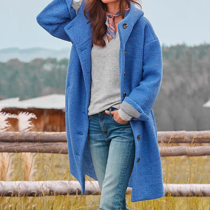 Close-up of a new women's hooded winter coat, showcasing warm fabric & stylish zipper detail.