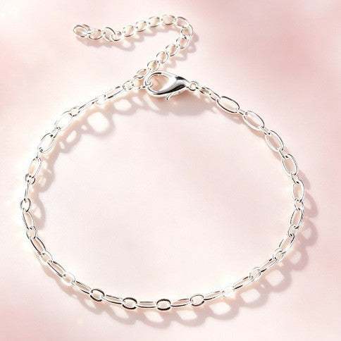 Stylish silver-tone interlocking link bracelet for women, adjustable and perfect as an elegant gift.