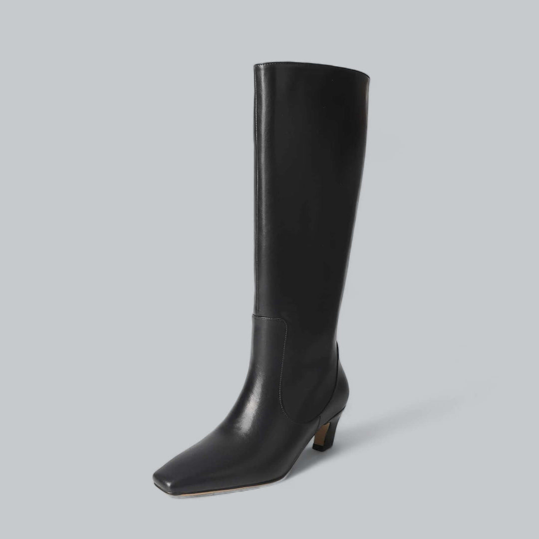 Elegant women's knee-high boots for timeless style. Perfect for fall and winter fashion. Versatile and comfortable.