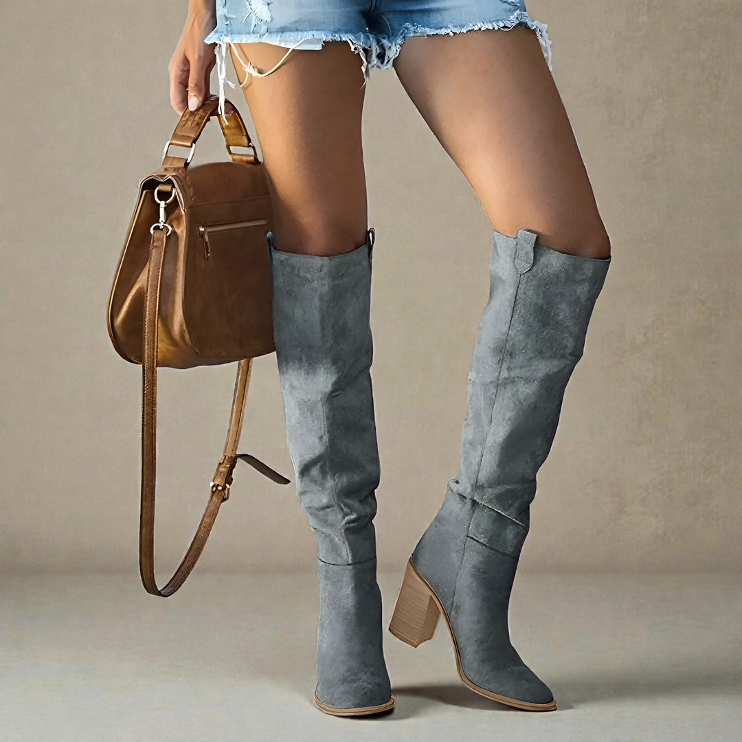 Elegant women's knee-high boots with a stylish block heel and closed toe for fall & winter fashion.