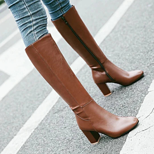 Comfortable women's heeled knee-high boots with a fashionable zipper and stable block heel for all-day wear.
