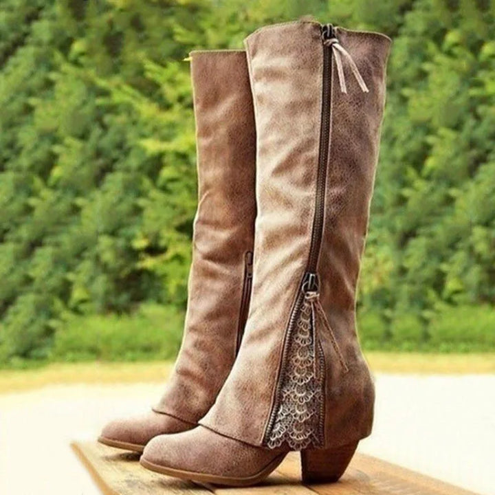 Elegant women's knee-high boots with lace-up detail, practical side zip, and comfortable block heel for autumn/winter.