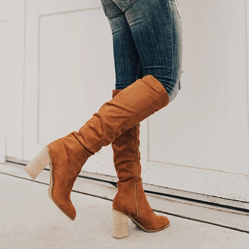 Elegant women's knee high slouch boots with easy side zipper and comfortable block heel for casual chic autumn fashion.