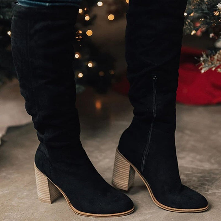 Fashionable women's knee-high slouch boots featuring an easy side zipper for autumn & winter style and comfort.