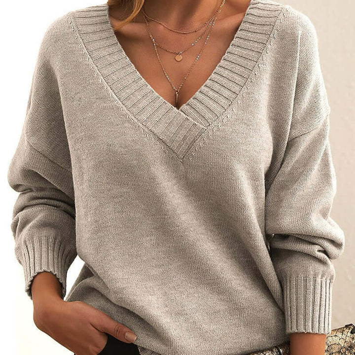 Women's knit sweater featuring elegant design, comfort & versatility. Perfect long sleeve top.