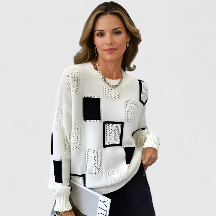 Elegant women's knitted sweater with intricate openwork design. Perfect for fall/winter casual or sophisticated everyday style.