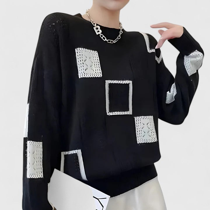 Sophisticated women's openwork knit sweater. Stylish long sleeve top for elegant fall and winter outfits.