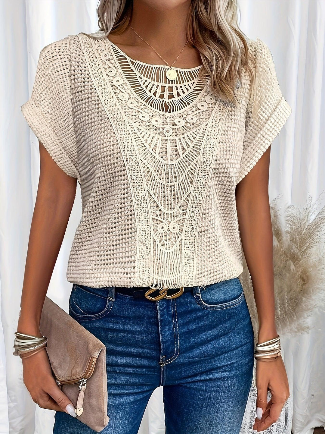 Elegant women's knitted top with intricate details, perfect for sophisticated style & versatile wear.