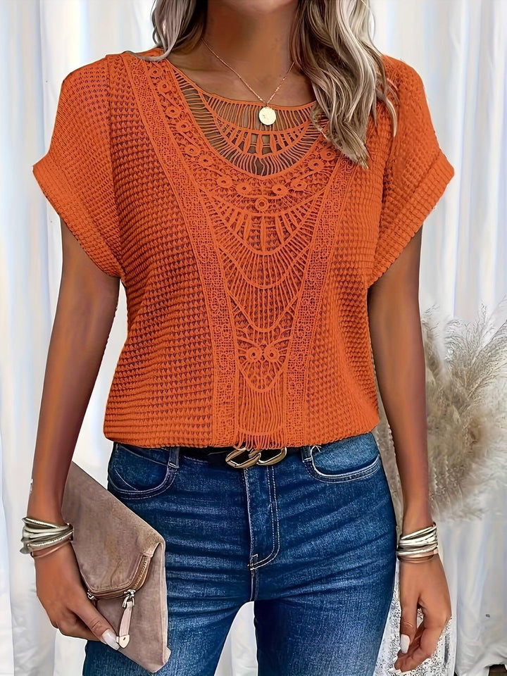 Sophisticated women's knit top, versatile for office attire or casual chic. Features intricate design.