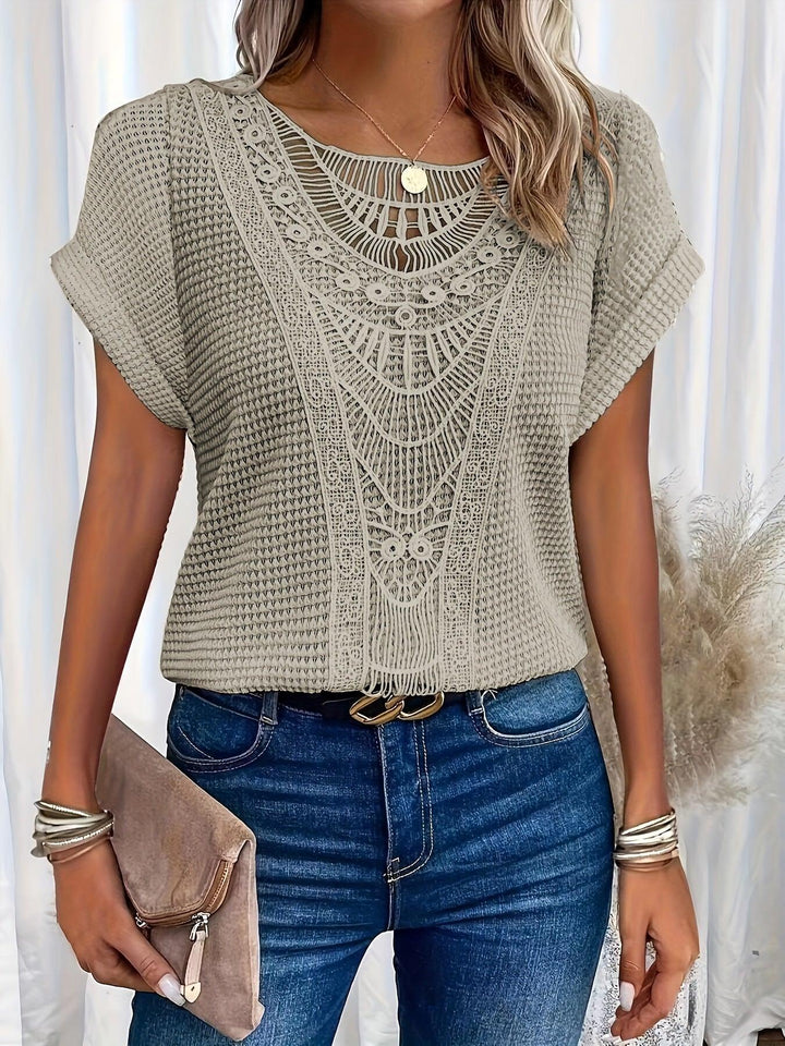 Full view of elegant women's knitted blouse, versatile for sophisticated style & comfortable fashion.