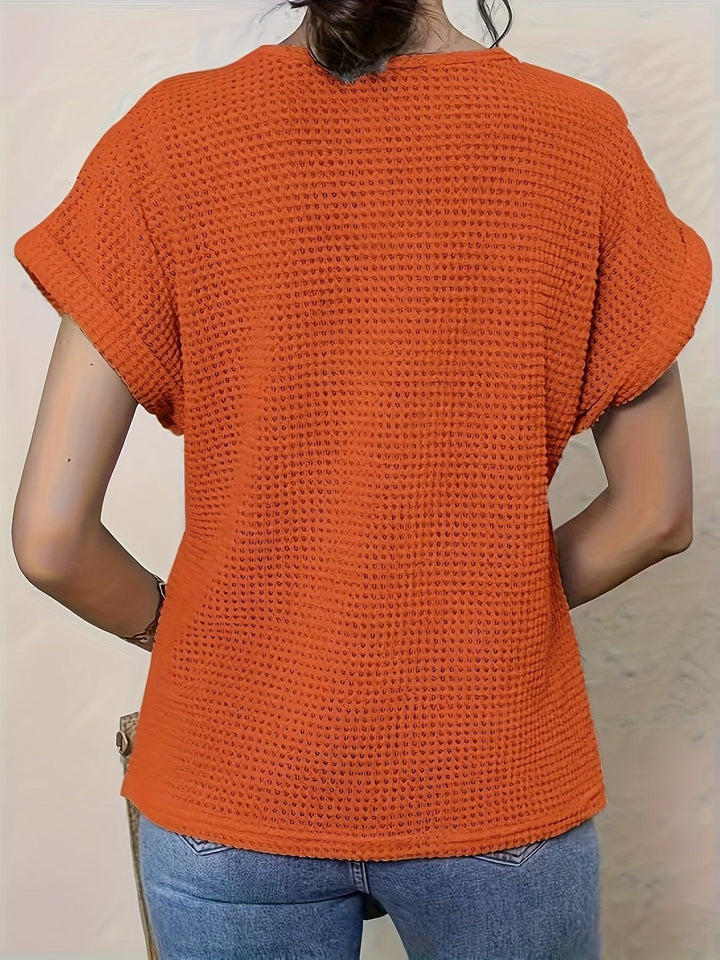 Stylish women's knitted top with intricate details, offering comfortable fashion & a sophisticated look.