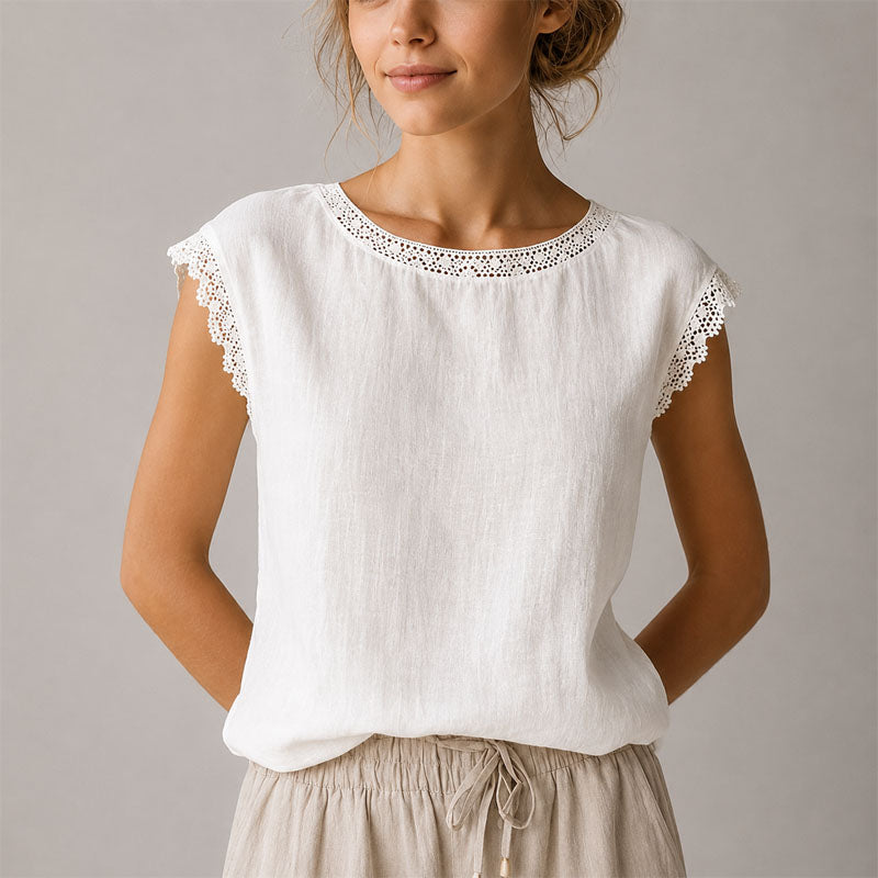 Versatile women's cap sleeve blouse featuring delicate lace trim and a flattering relaxed fit top.