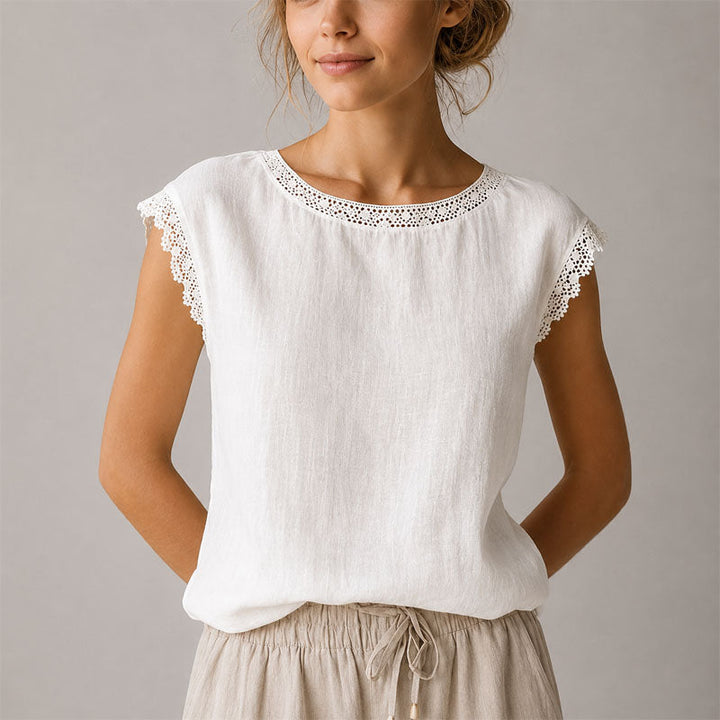Versatile women's cap sleeve blouse featuring delicate lace trim and a flattering relaxed fit top.