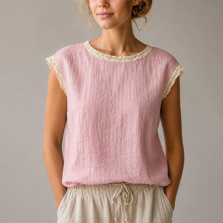 Stylish women's lace trim cap sleeve blouse, offering an elegant look and comfortable relaxed fit for women.