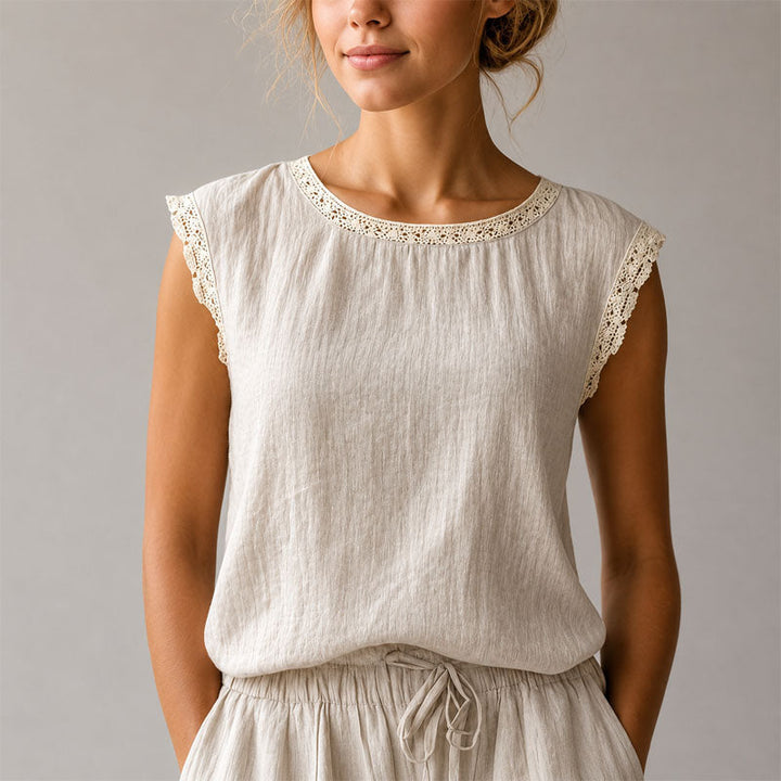 Chic women's relaxed fit blouse, adorned with delicate lace trim, an elegant and versatile everyday top.