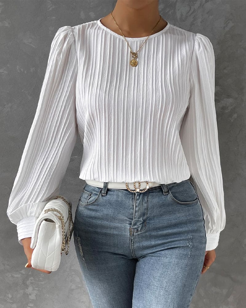 Elegant women's lantern sleeve blouse with classic round neck, perfect for workwear.