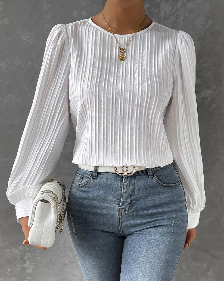 Elegant women's lantern sleeve blouse with classic round neck, perfect for workwear.