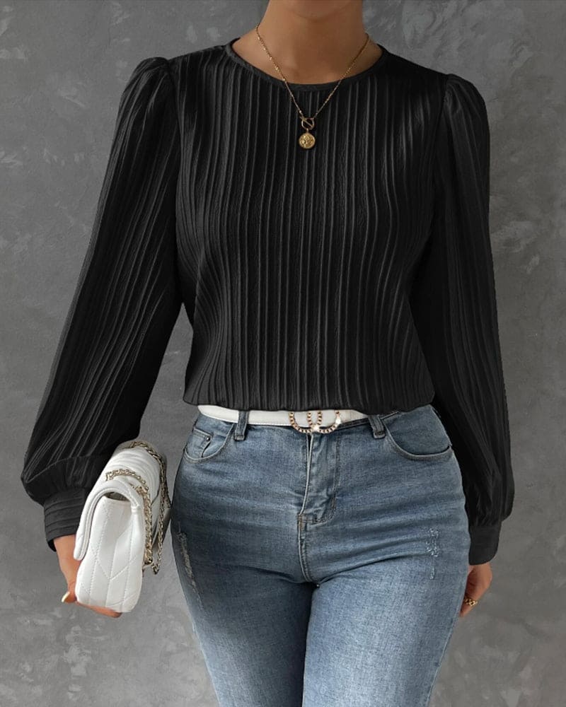 Chic women's long sleeve top featuring stylish lantern sleeves and a comfy round neck.