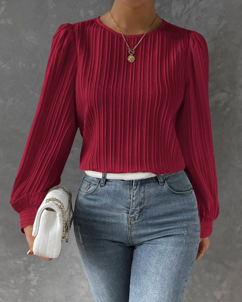 Versatile women's blouse: elegant round neck & fashionable lantern sleeves for everyday style.