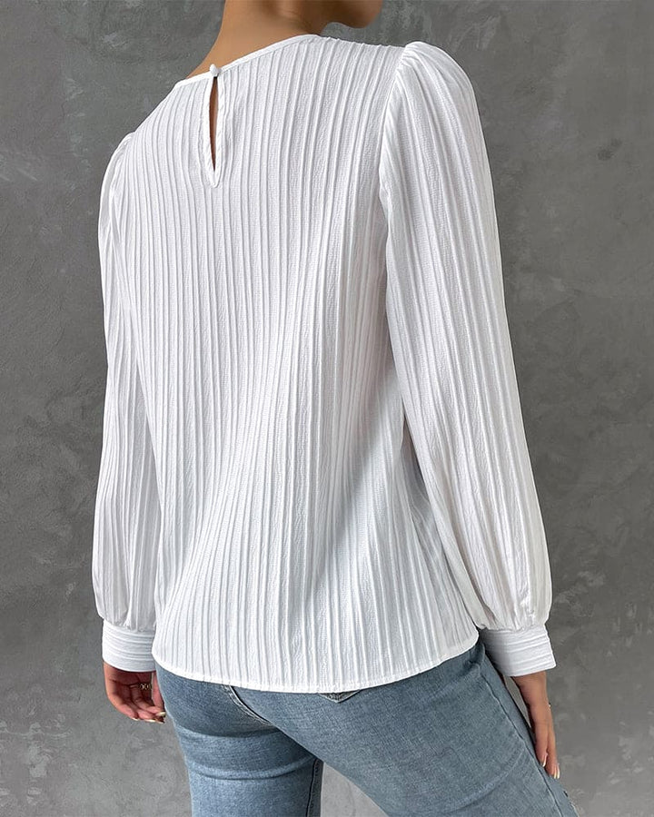 Everyday style women's round neck top, featuring trendy lantern sleeves; comfortable & chic.