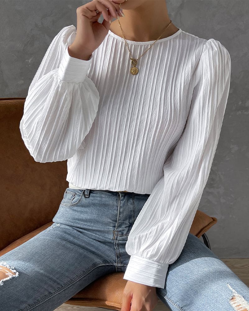 Fashionable women's blouse with elegant lantern sleeves & a classic round neckline, versatile.