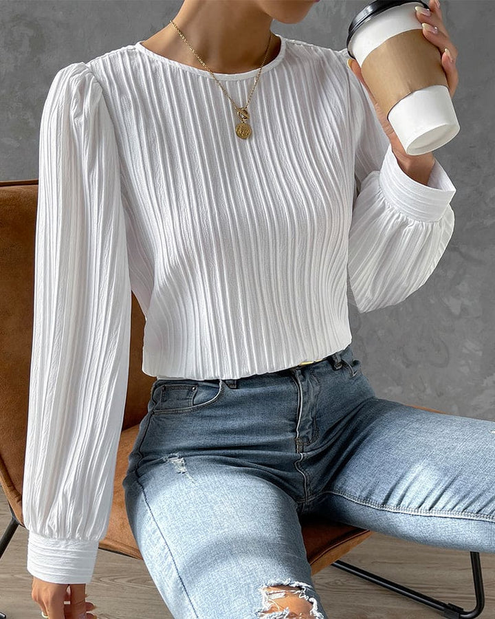Women's long sleeve top: round neck, chic lantern sleeves, perfect for casual or work wear.
